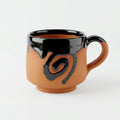 Terracotta Coffee Cup — Black Glazed Clay Cup with Swirl Motif