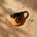 Terracotta Coffee Cup — Black Glazed Clay Cup with Swirl Motif
